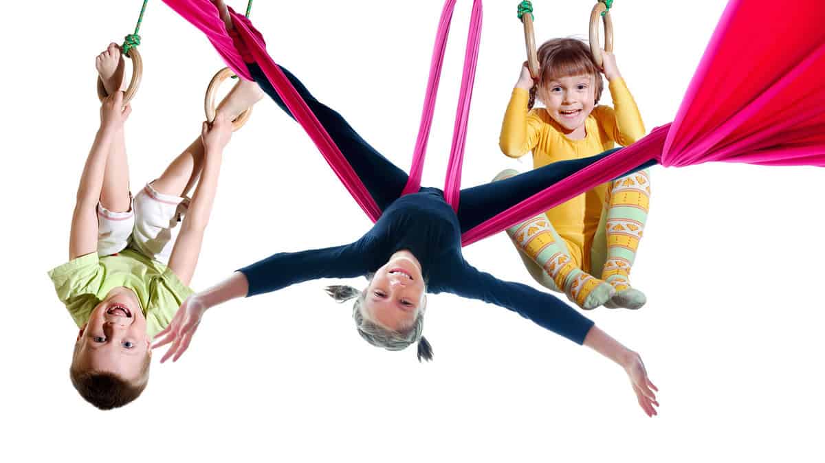 group of barefeet children shouting screaming jumping dancing exercising, Isolated over white background. Childhood, freedom, happiness, active lifestyle concept. Young jumpers kids girls boys