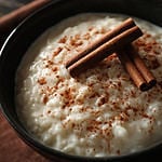 Delicious rice pudding with cinnamon in bowl, closeup