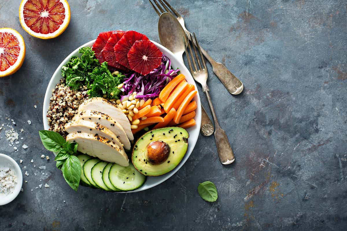 Healthy lunch bowl with grilled chicken, avocado and quinoa