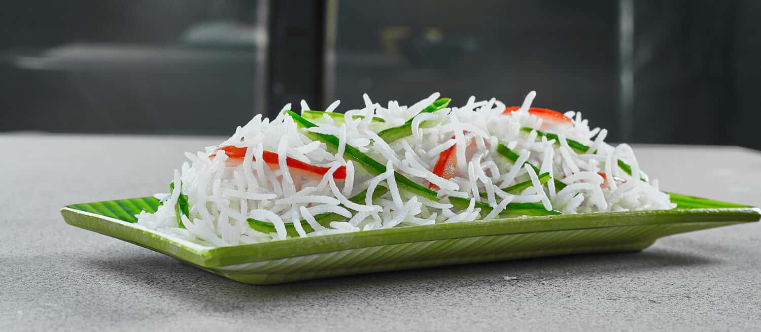 A close-up of long grain white basmati rice.