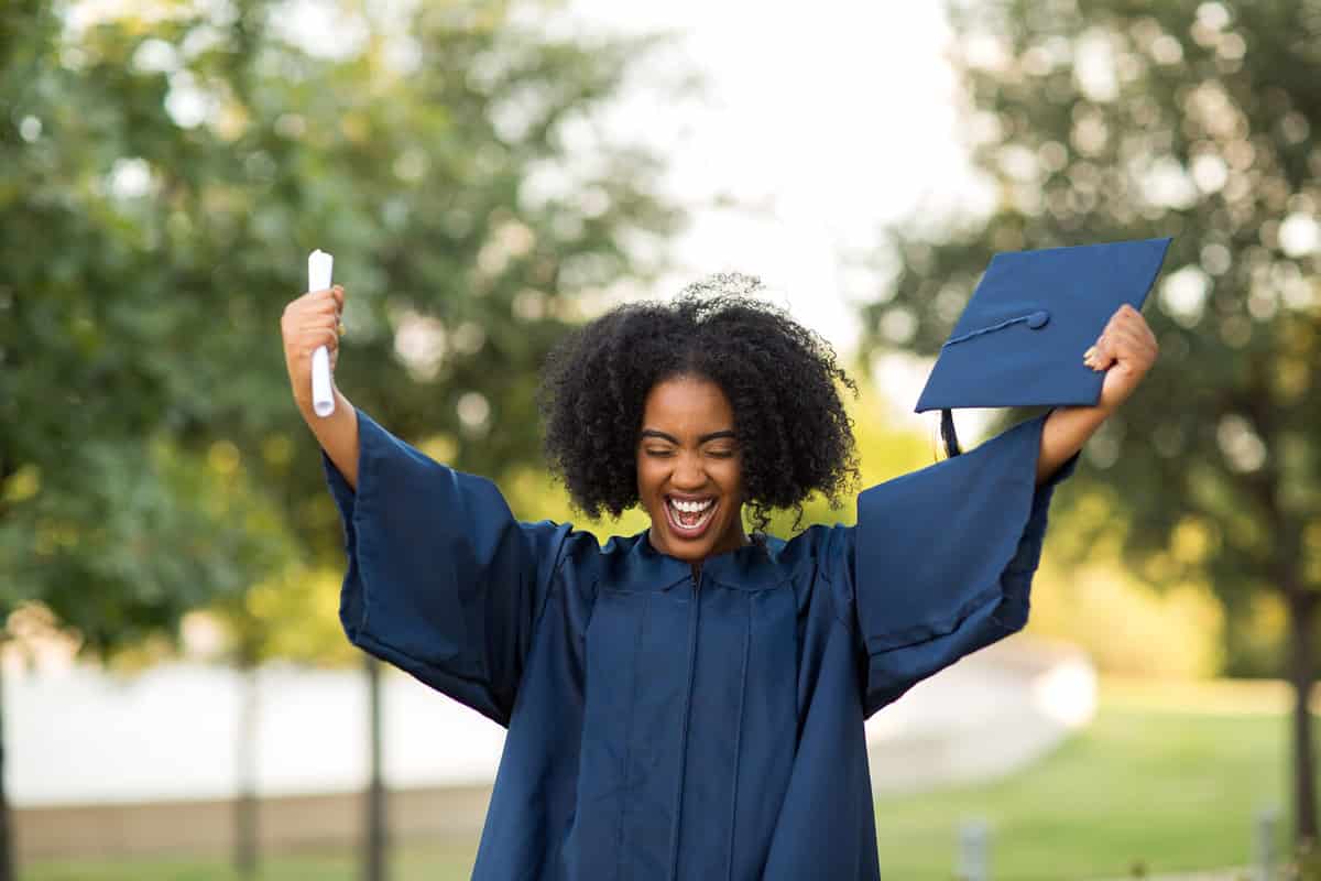 Excited African American woman at her graduation.