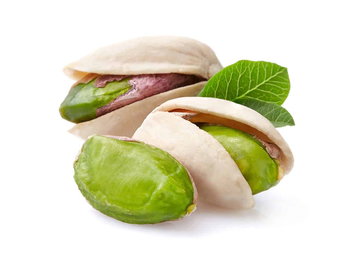 Pistachio with leaves in closeup