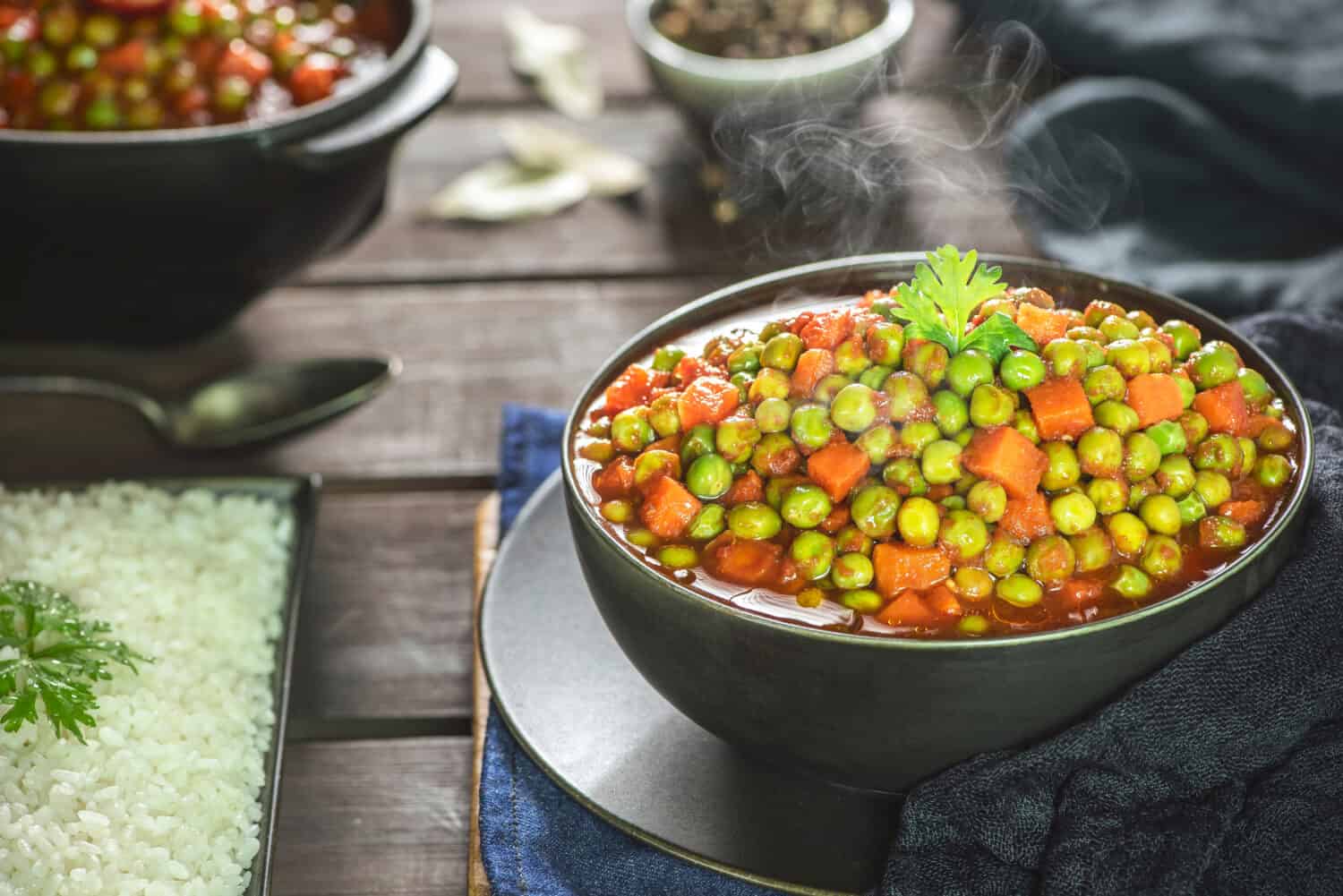 Arabic Cuisine; Middle Eastern traditional peas and carrot stew. A delicious vegan meal with peas and carrot doused in aromatic tomato sauce. Served with white rice and oriental pickles.