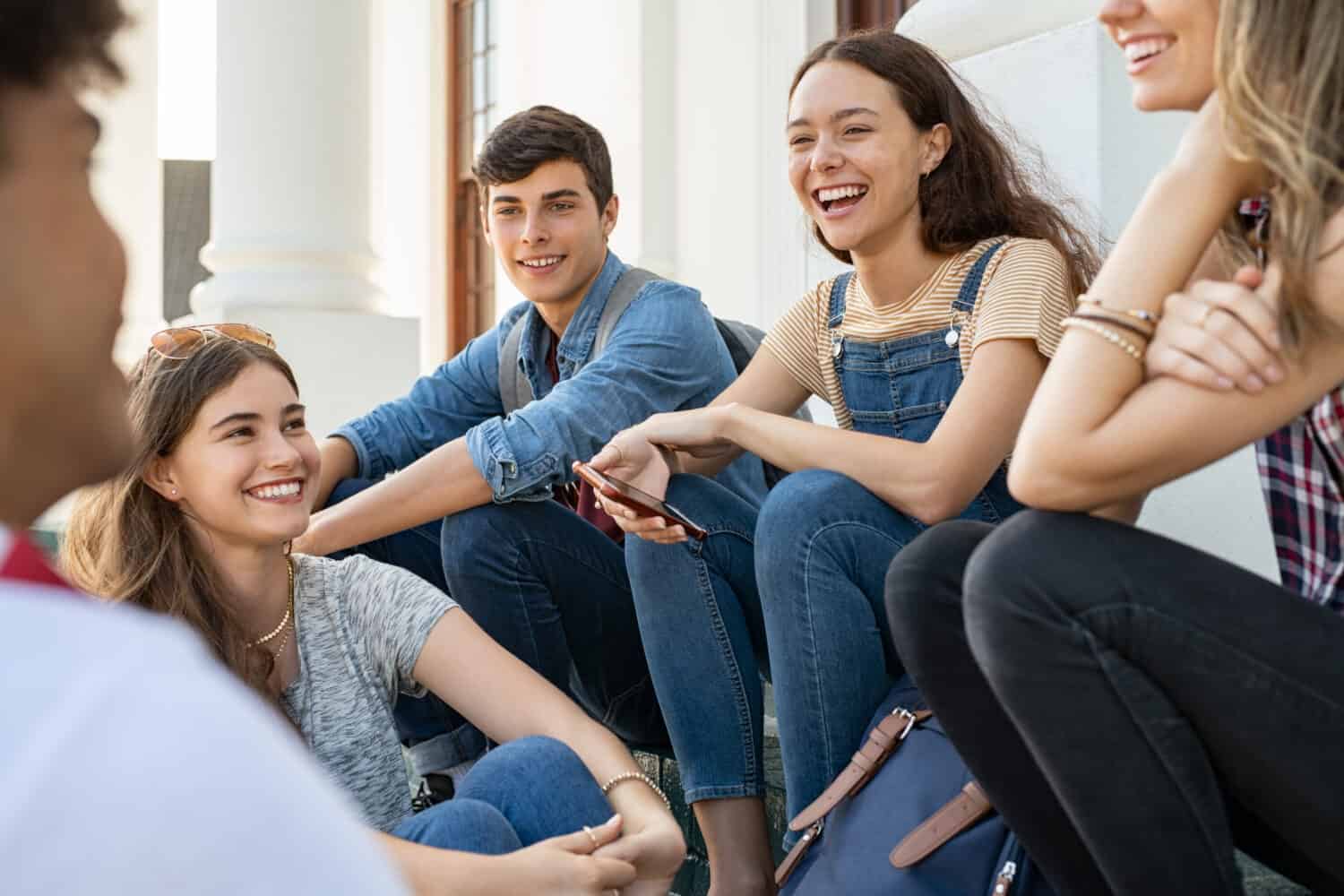 A group of cheerful high school students on a break.