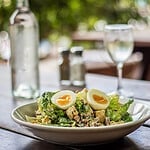 Classic Fresh Caesar Salad Cool crunchy cos lettuce, bacon, garlic croutons, chilled free range hard boiled egg, house-made Caesar dressing, parmesan cheese