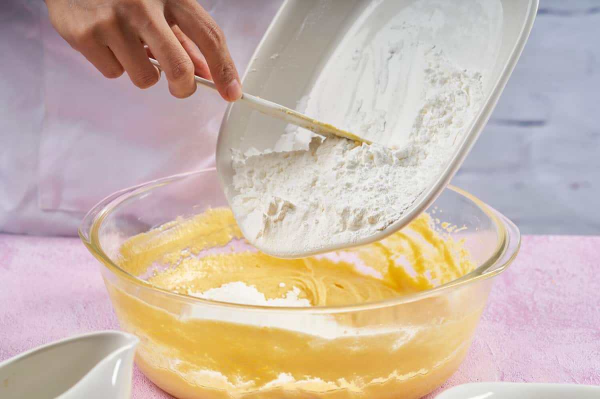 Prepared cornstarch alfajores. Adding flour and cornstarch to prepare alfajores