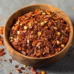 Raw Organic Red Pepper Flakes in a Bowl