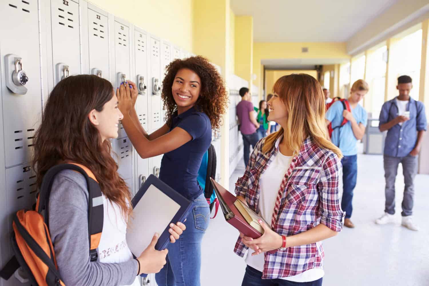 Group of Female High School Students Talking by Lockers