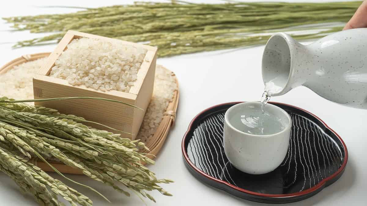 Japanese sake on the table. Sake, white rice and ear of rice.Sake is Japanese rice wine.