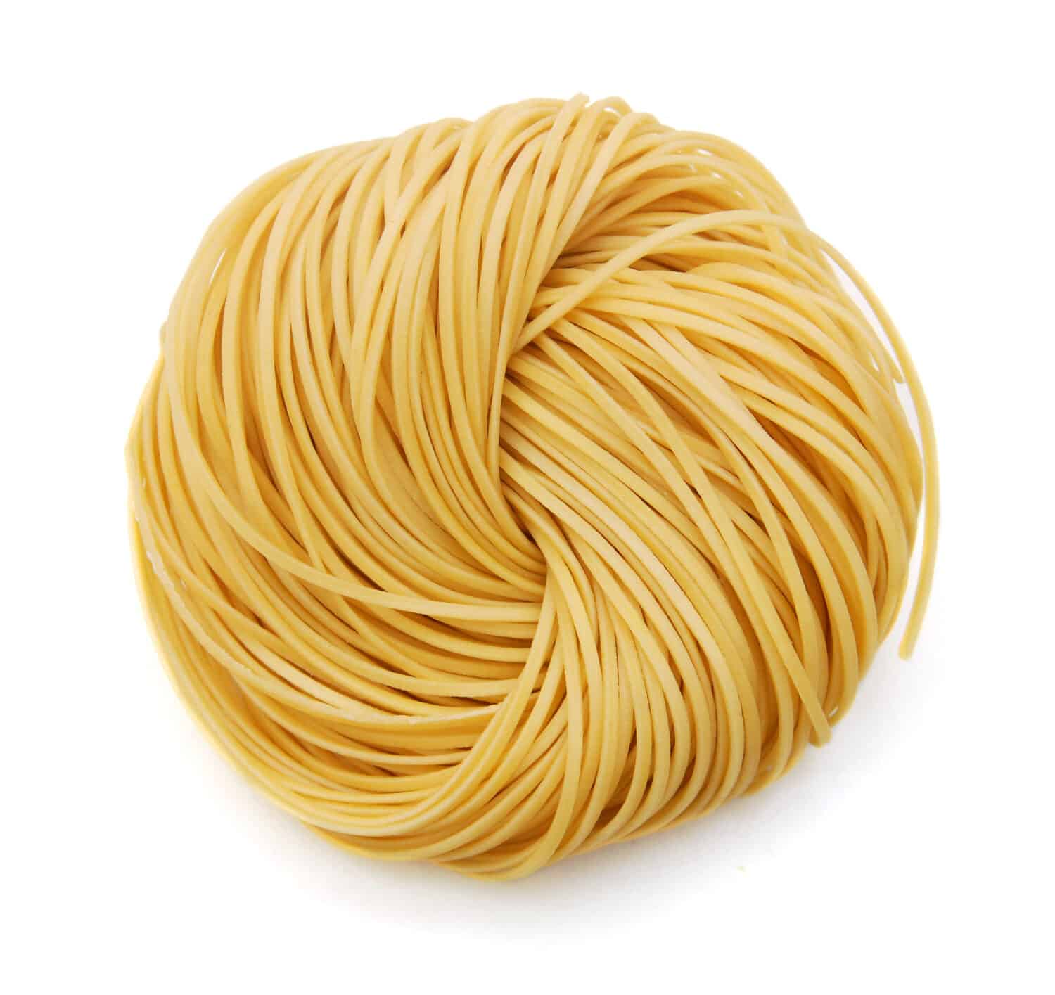 Egg noodles on a white background