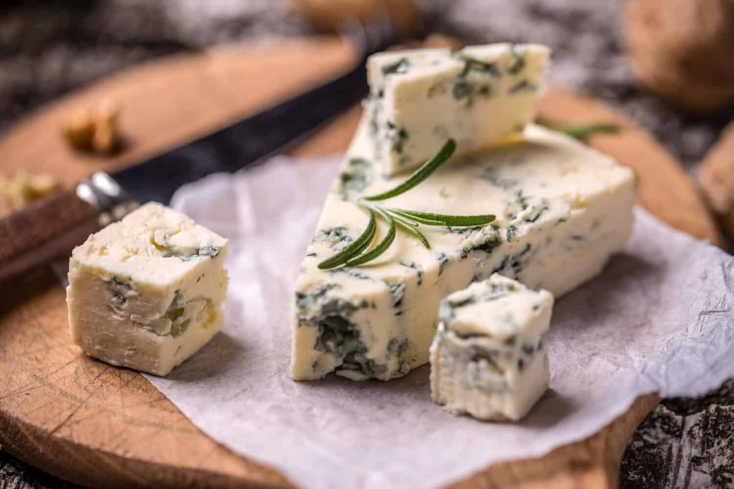 Slice of French Roquefort cheese with walnuts