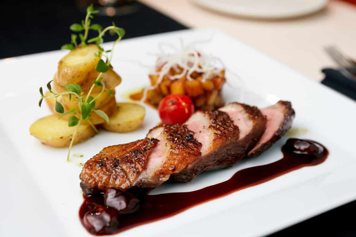 Roasted duck with pear,marinated in red wine and mascarpone rose