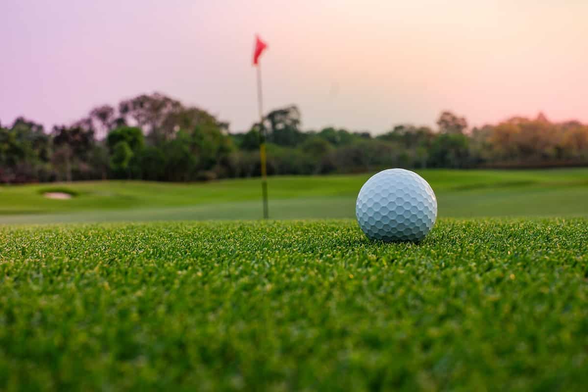 A long putt on the green as sunset closes in