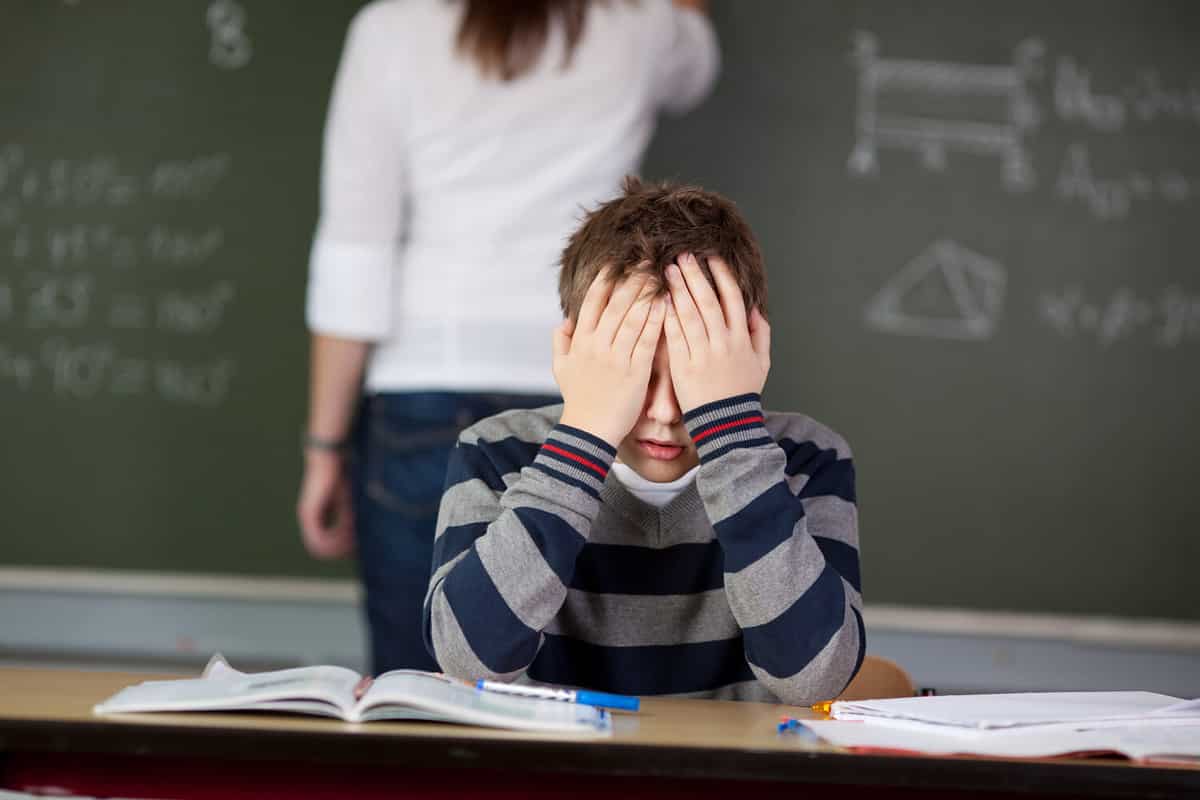 Stressed male student can't cope anymore during class