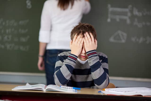 Stressed male student can't cope anymore during class