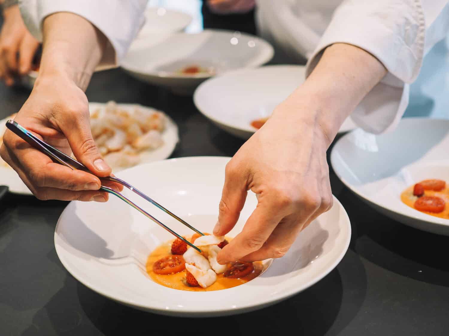 Chef cooking dinner with few dishes