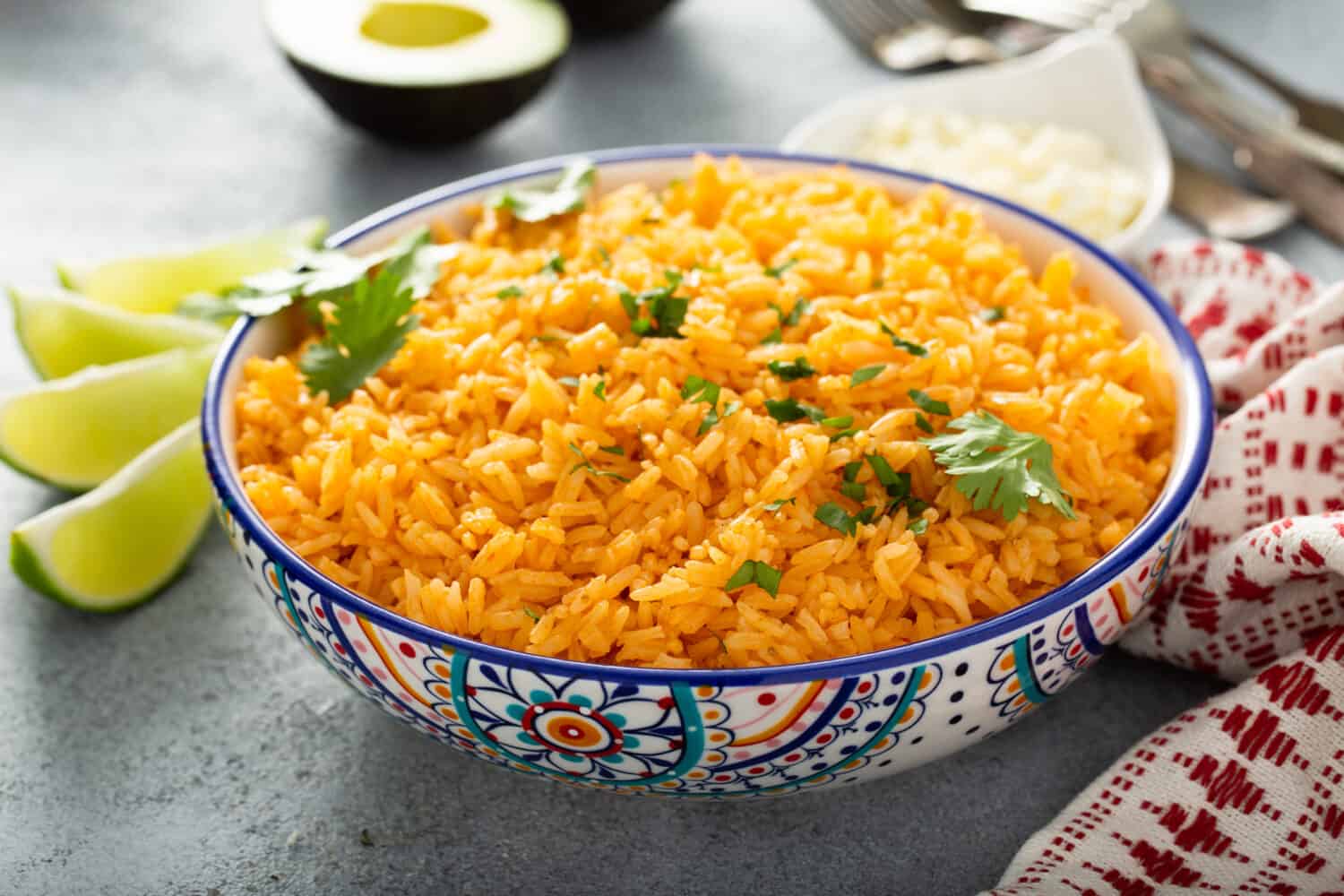 Mexican rice with tomatoes and onion served with cilantro