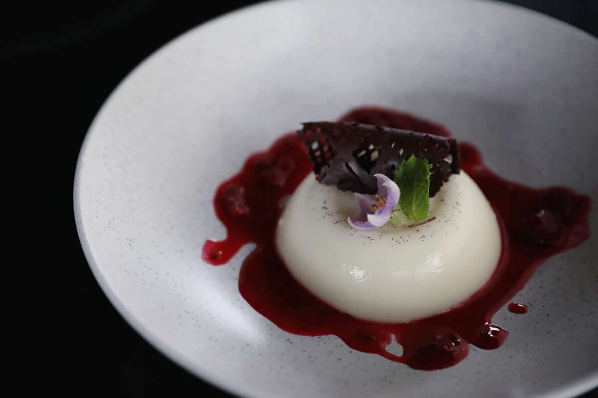 Panna cotta dessert with strawberry sauce