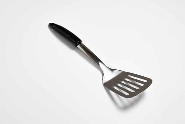 Kitchen Spatula Stainless steel isolated on white background.Slotted Spatula.High resolution photo.Top view.