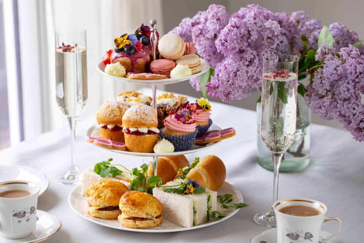 Traditional english afternoon tea with selection of cakes and sandwiches