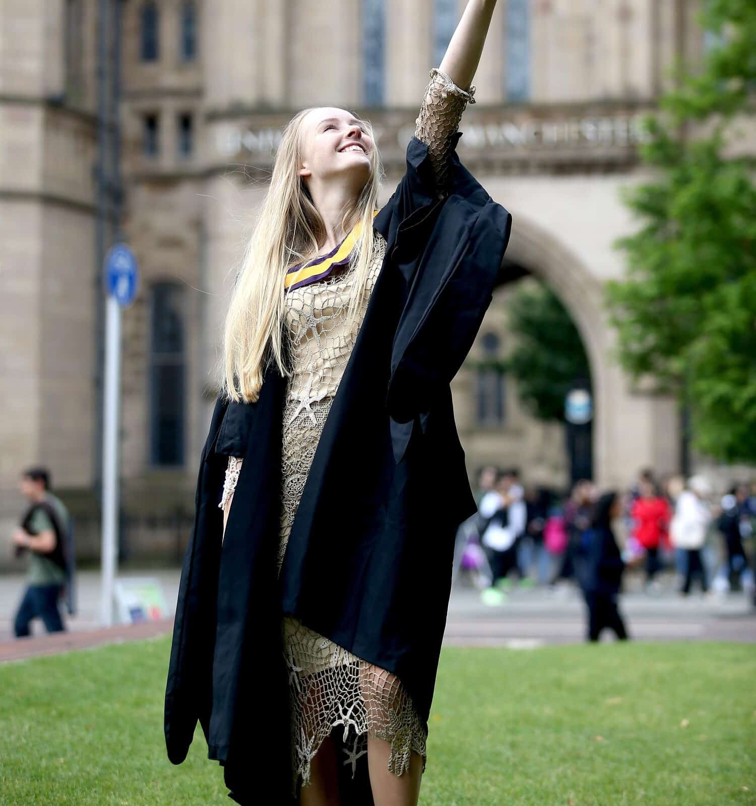 Portrait of a happy woman on her graduation day at university. Education and people.