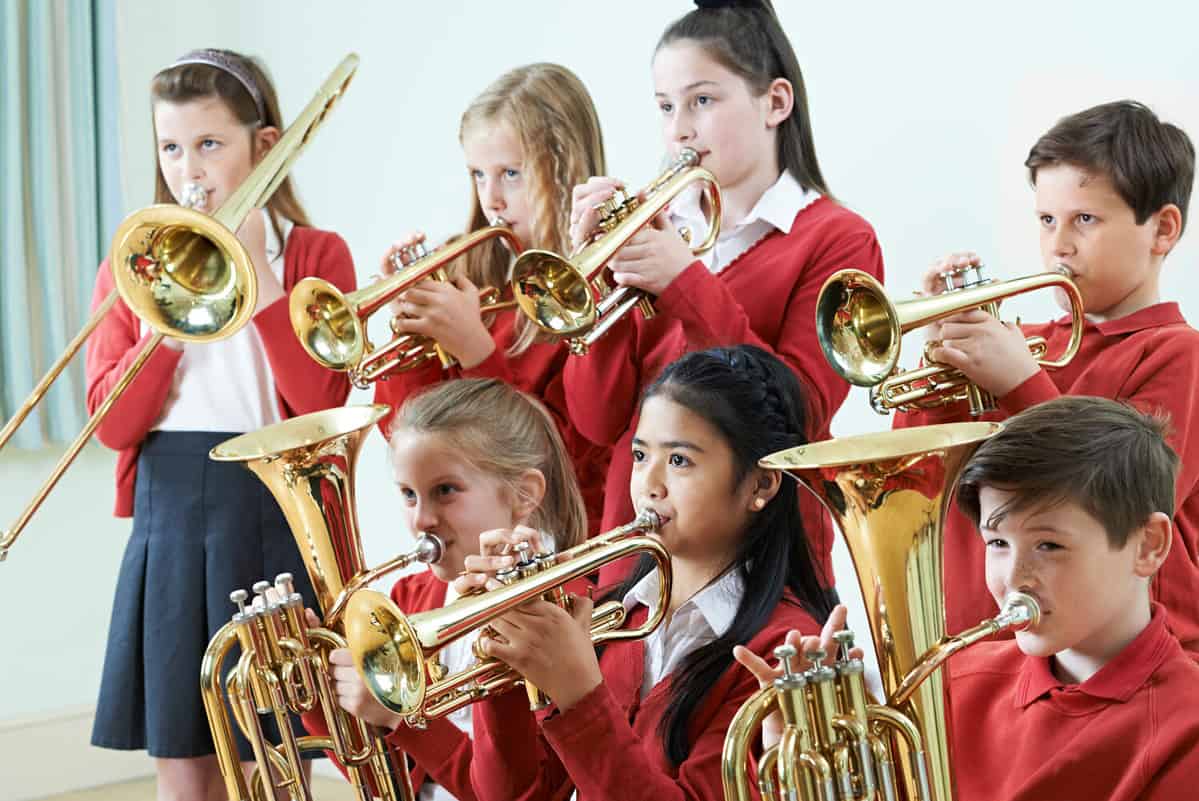 Group Of Students Playing In School Orchestra Together