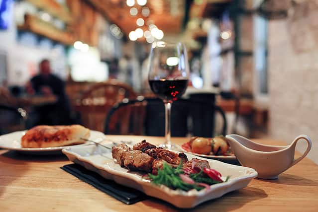 Dinner on the table in the evening in a cafe