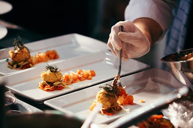 Chef preparing food, meal, in the kitchen, chef cooking in kitchen, Chef decorating dish, closeup