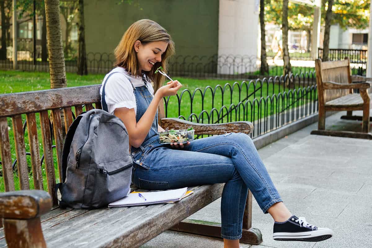 Student girl having healthy lunch