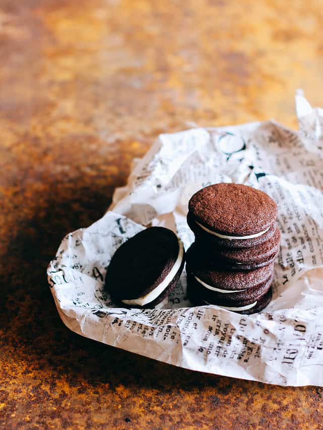 SURGUT, RUSSIA - September 2015: Homemade chocolate oreo cookies on newspaper