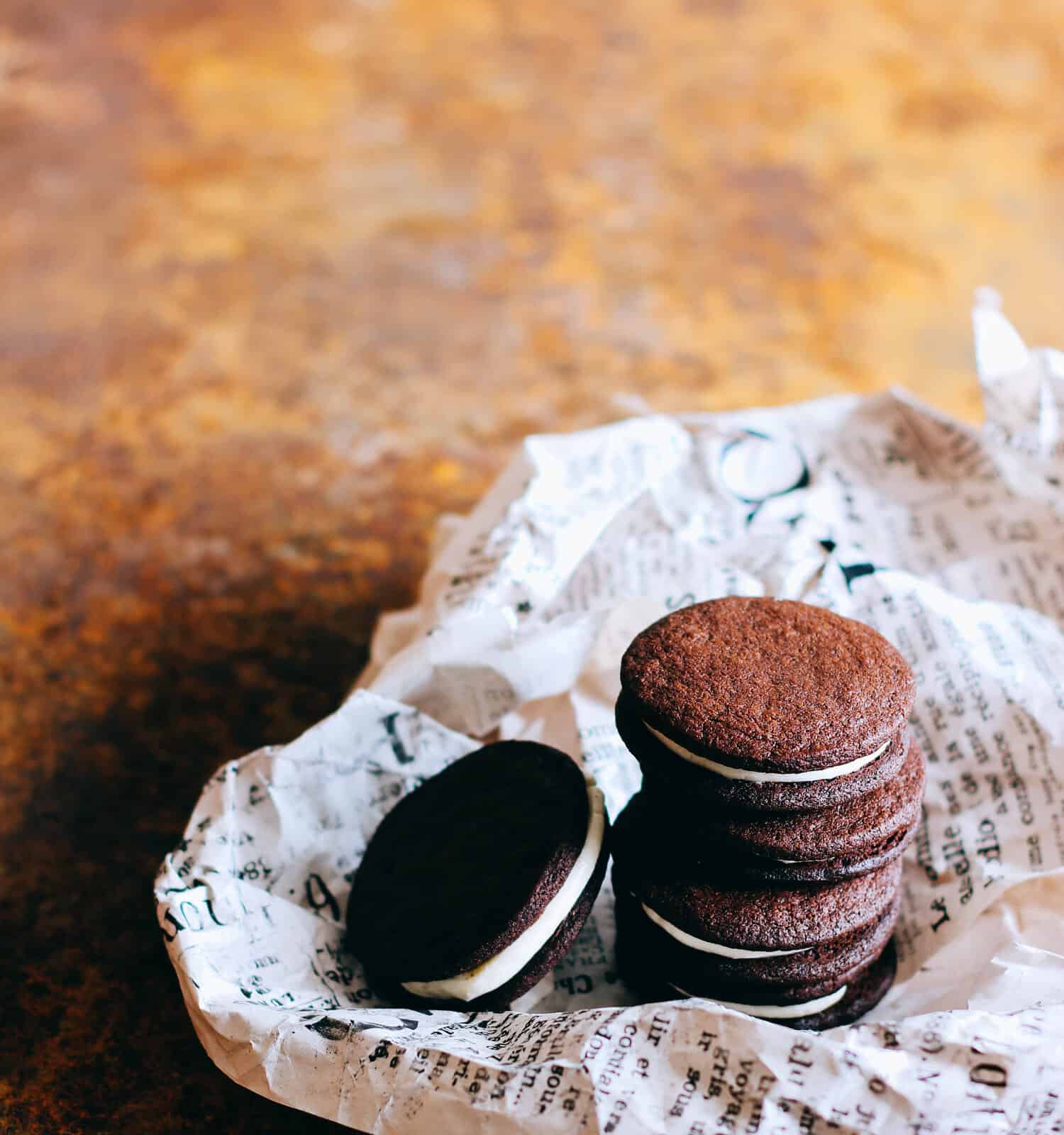 SURGUT, RUSSIA - September 2015: Homemade chocolate oreo cookies on newspaper