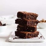 A stack of chocolate brownies on white background, homemade bakery and dessert. Bakery, confectionery concept