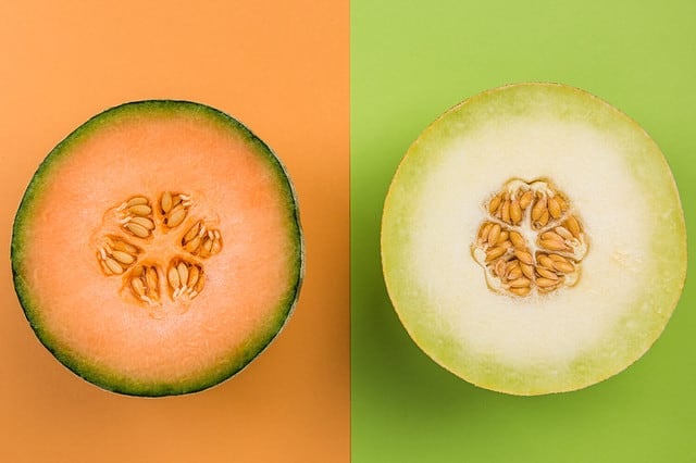 Cantaloupe and Honeydew Whole Melon Sliced in Half, Top View, Pastel Background.