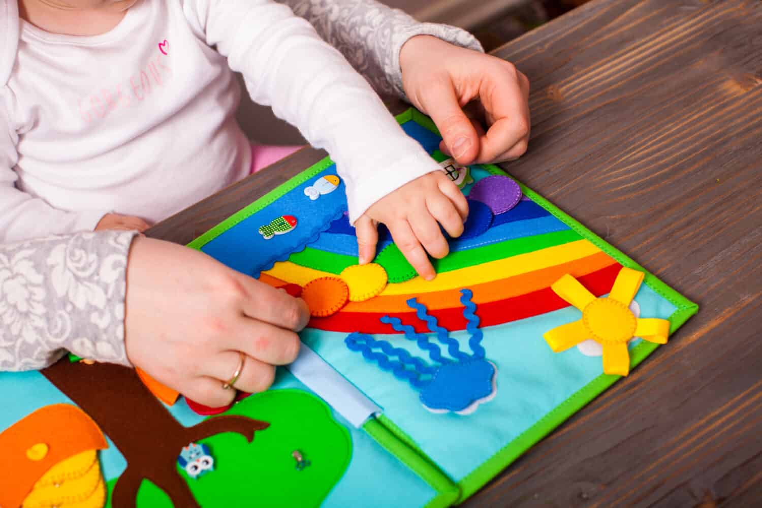 Mom is interesting teaching her daughter colors