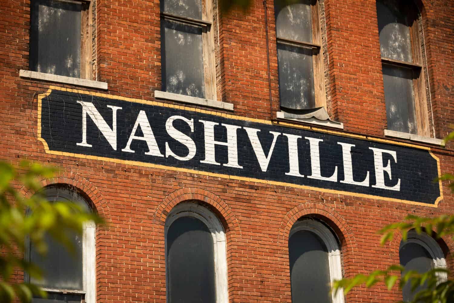 City of Nashville Tennessee USA sign painted on the side of a brick building