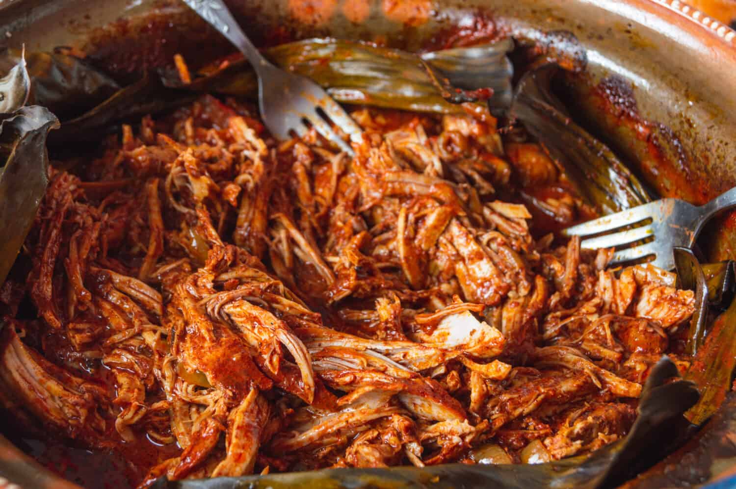 Mexican food. Preparing Cochinita Pibil, a Yucatecan pit-roasted pork dish, a fusion of Maya and European influences.