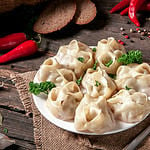 Stuffed dumplings, manti of dough and minced, close up