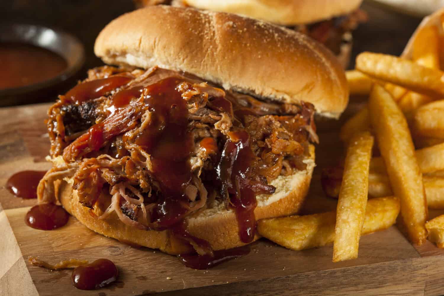 Barbeque Pulled Pork Sandwich with BBQ Sauce and Fries