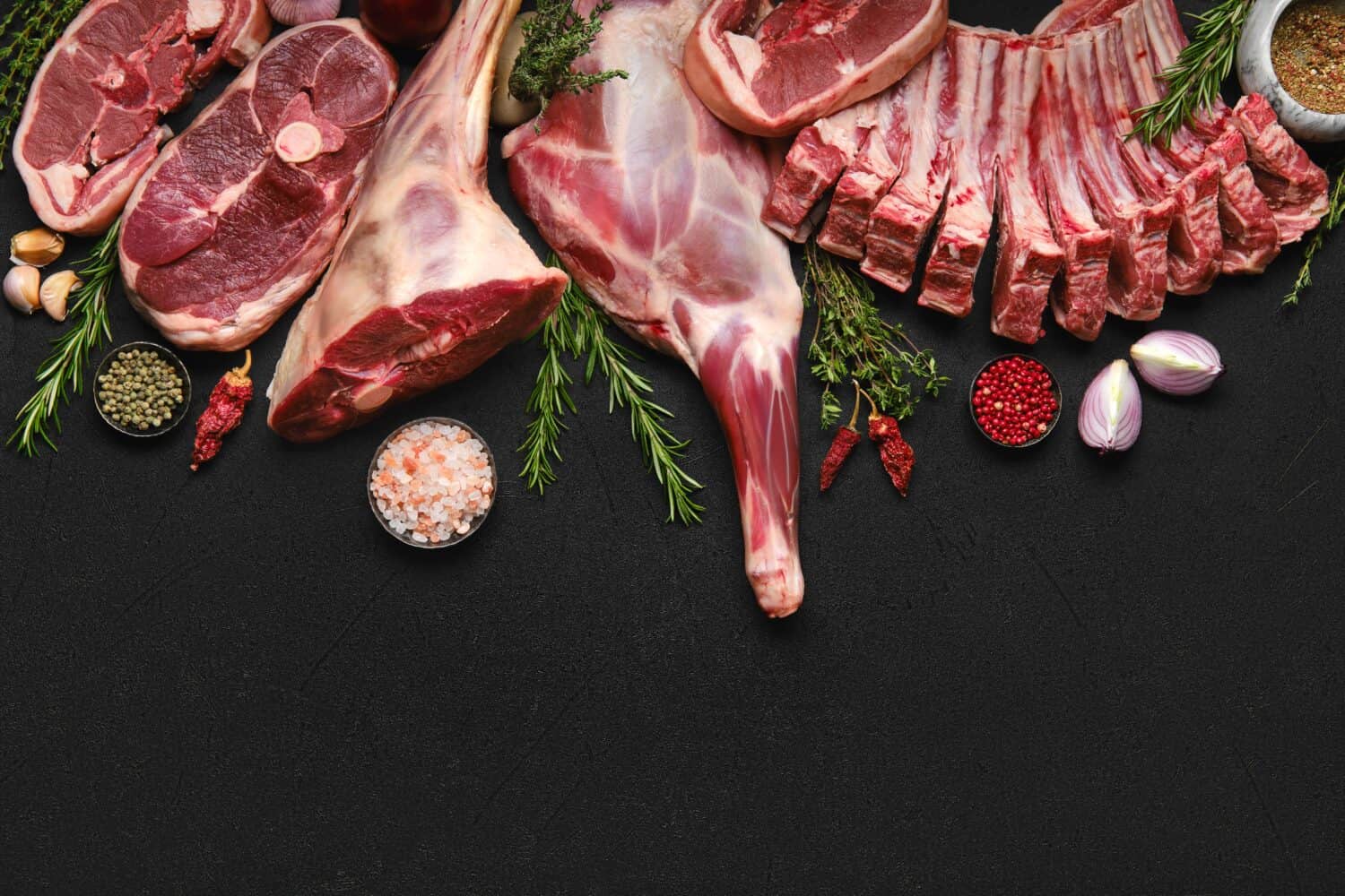 Assortment of various raw lamb cut parts with copy space