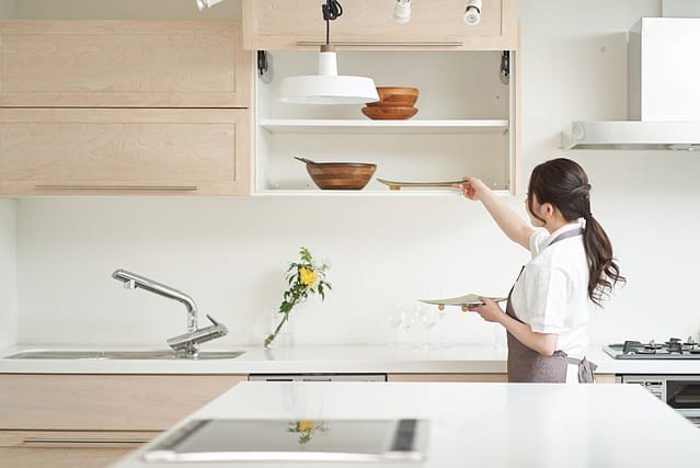 Asian woman organizing the kitchen