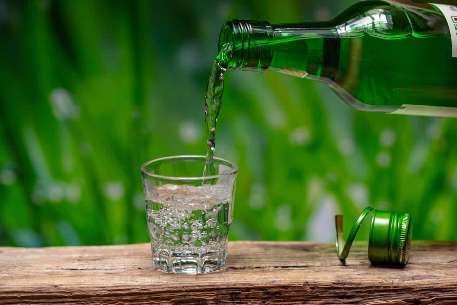 Pouring Soju, Korean liquor, into a shot glass