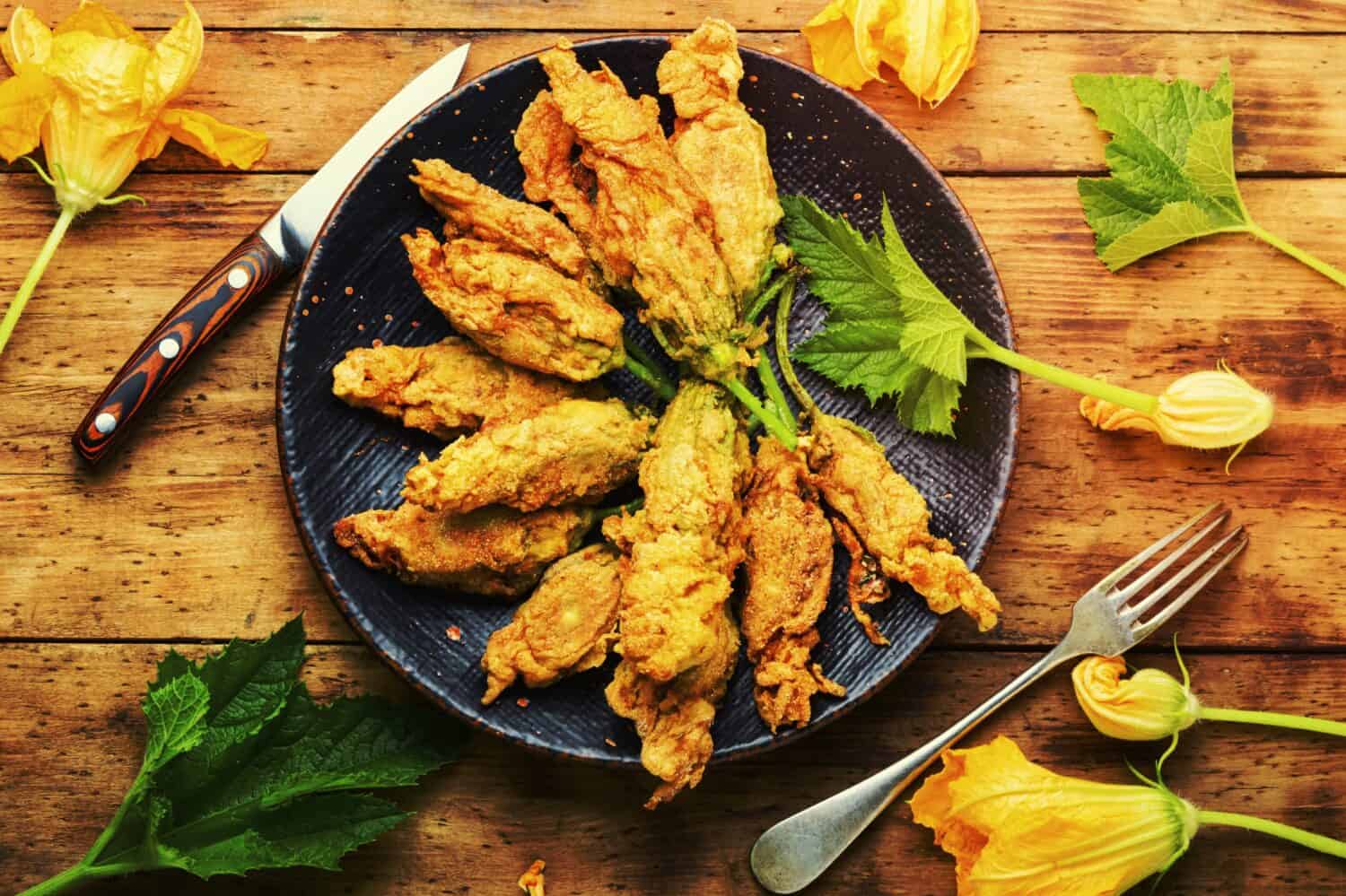 Fried zucchini flowers stuffed cottage cheese.Roasted courgette flowers.Healthy food,stuffed squash blossoms