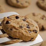 Homemade chocolate chip cookies served with a spatula