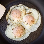 Over-easy eggs with fresh salsa and coffee