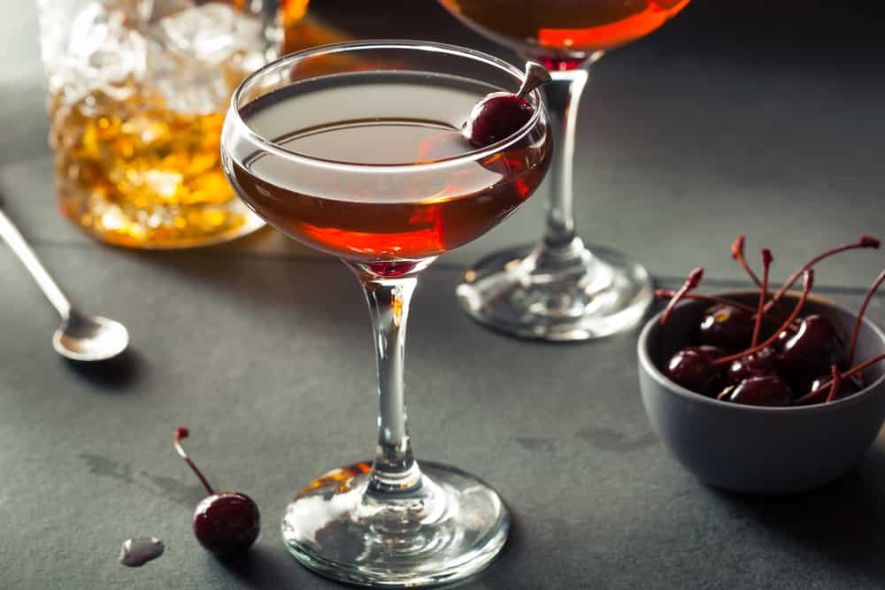 Homemade Rye Bourbon Manhattan with a Cherry Garnish