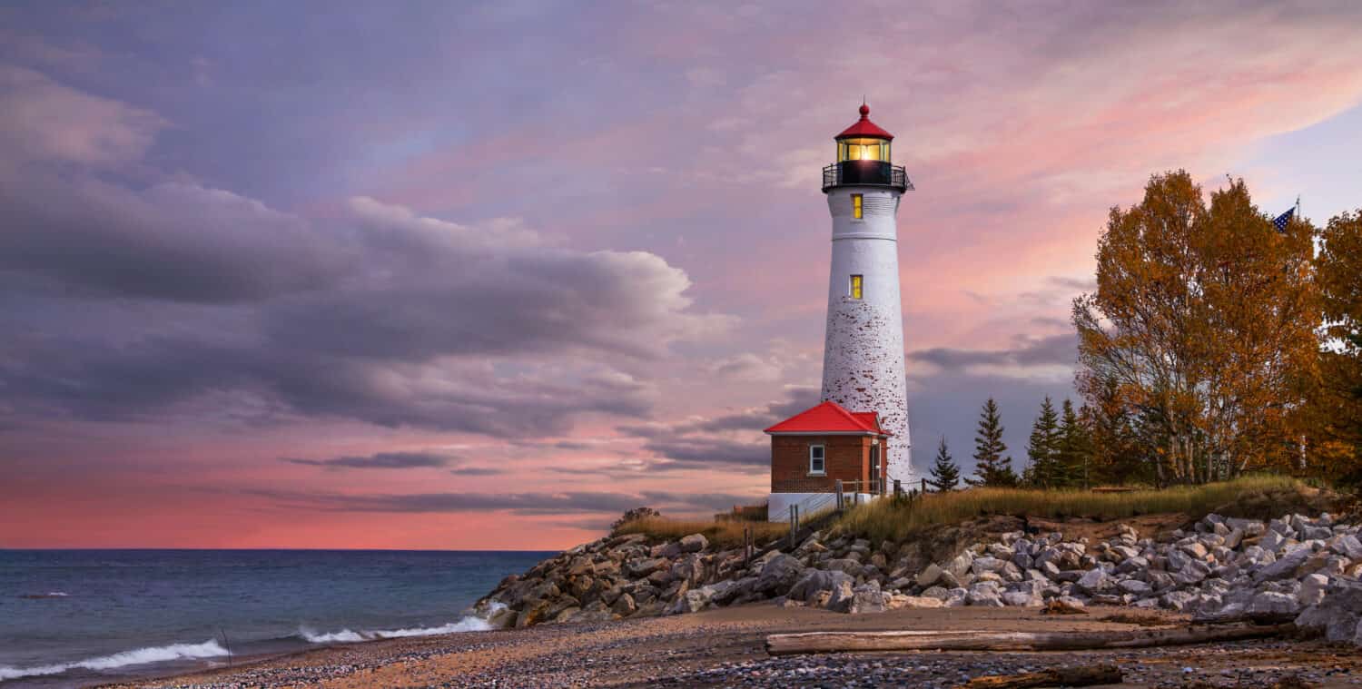 As daylight begins yielding to twilight, The Crisp Point Lighthouse at sunset on Lake Superior, Upper Peninsula, Michigan, USA - A one hour drive from Tahquamenon Falls, mostly dirt roads