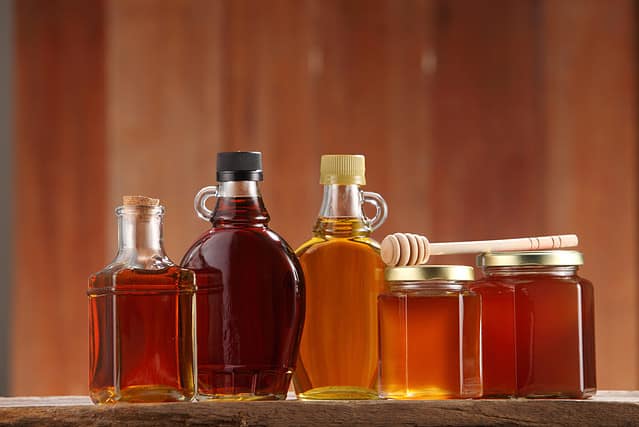syrup and honey on the wooden background