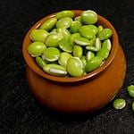 lima beans in the brown pot as food background