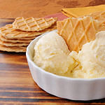 A bowl of French vanilla ice cream with gourmet caramel butter toffee wafers