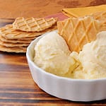 A bowl of French vanilla ice cream with gourmet caramel butter toffee wafers